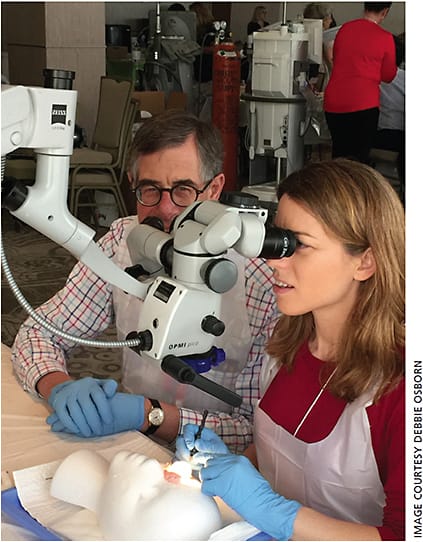 Richard Packard, MD, ESCRS Binkhorst Award recipient, assisting an attendee with one-on-one instruction in the wetlabs.