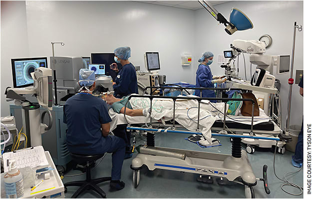 Dr. Tyson performing femtosecond laser treatment in the same operating room as the operating microscope and phacoemulsification machine, as seen in the background.