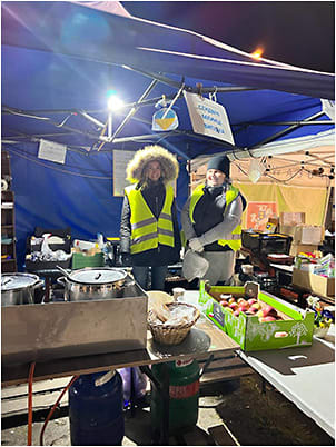 Volunteers at Aid/Greeting Station on Polish side of Ukrainian border, near Lutsk. Image courtesy: Emil William Chynn, MD, FACS, MBA