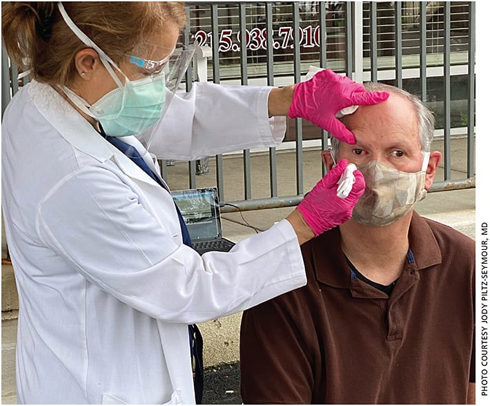 Dr. Jody Piltz-Seymour tests a patient’s IOP in the Valley Eye Professionals parking lot.