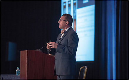 Mark Dunbar, O.D., lecturing at OMS. The meeting offered a total of 60 hours of CE credits through courses in four separate tracks.&#xA;PHOTO CREDIT: Mindy Crawford