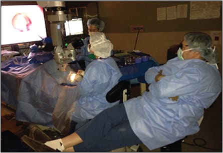 Figure 3. NGENUITY being used for primary surgical viewing in a teaching environment in a patient undergoing phacovitrectomy/PCIOL/25 g PPV/ERM peel. Note the ergonomics of the attending and the operating fellow.