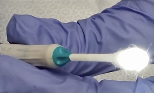 Figure 4. Stabilize the cotton swab tip with either sterile tape or a finger.