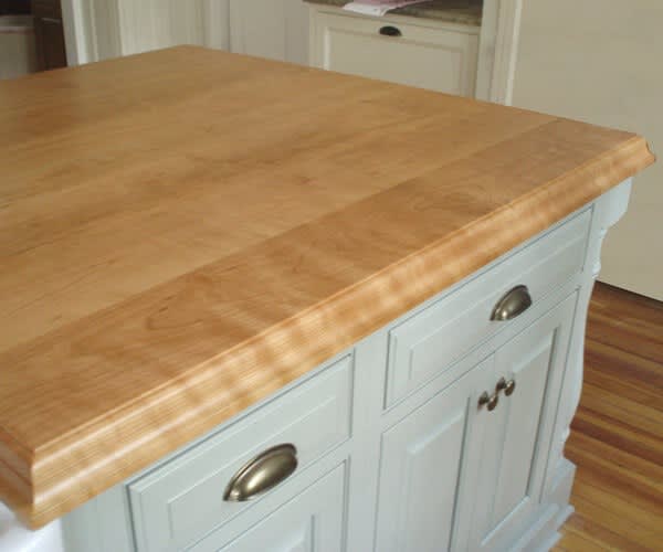 2 1/4" thick maple premium wide plank countertop. Natural color with Marine Oil Finish and an ogee-J edge.