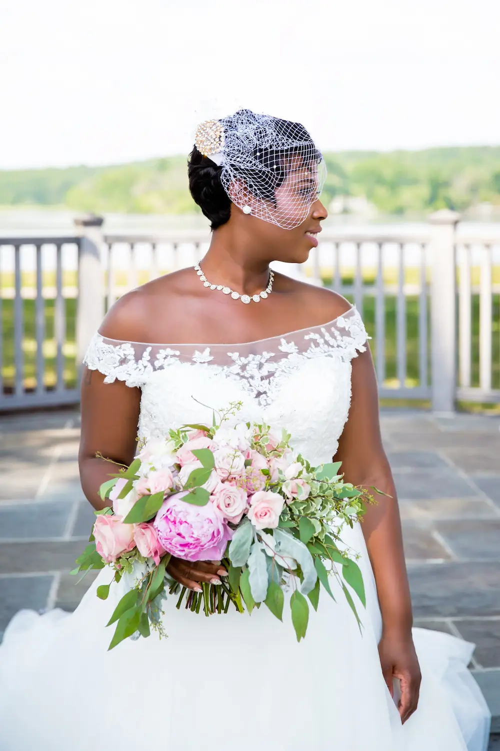 Black bride with bouquet.