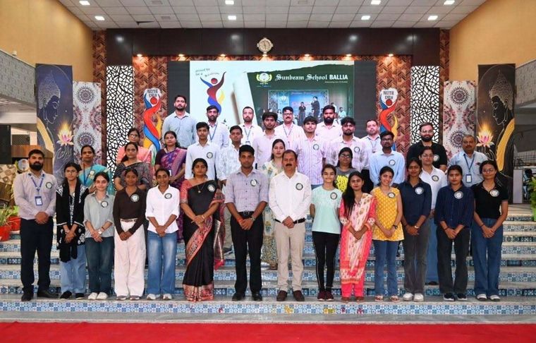 Alumni and staff of Sunbeam School Ballia gathered on the school steps for Pradiptam 2.0, beneath a Sunbeam School Ballia backdrop.