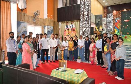 Alumni and staff of Sunbeam School Ballia standing around the ceremonial lamp at the opening of Pradiptam 2.0.