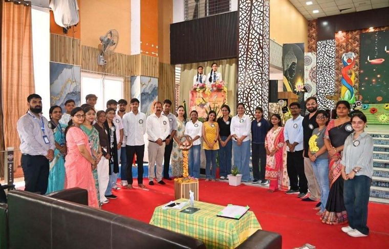 Alumni and staff of Sunbeam School Ballia standing around the ceremonial lamp at the opening of Pradiptam 2.0.