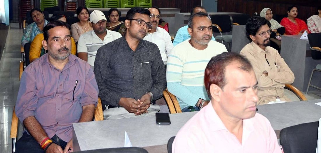 A closer view of parents seated in the rows at a Parents' Forum sitting at Sunbeam School Ballia