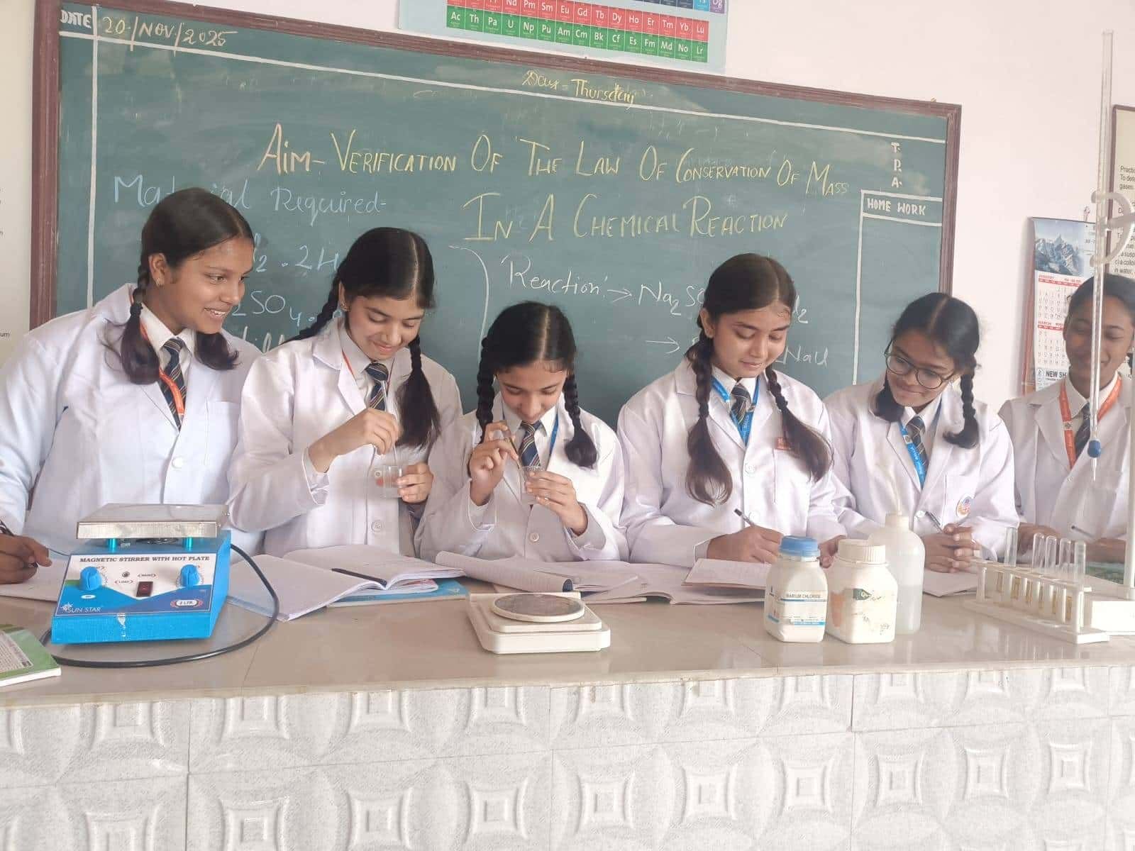 Students of Sunbeam School Ballia working at the bench during a science practical.