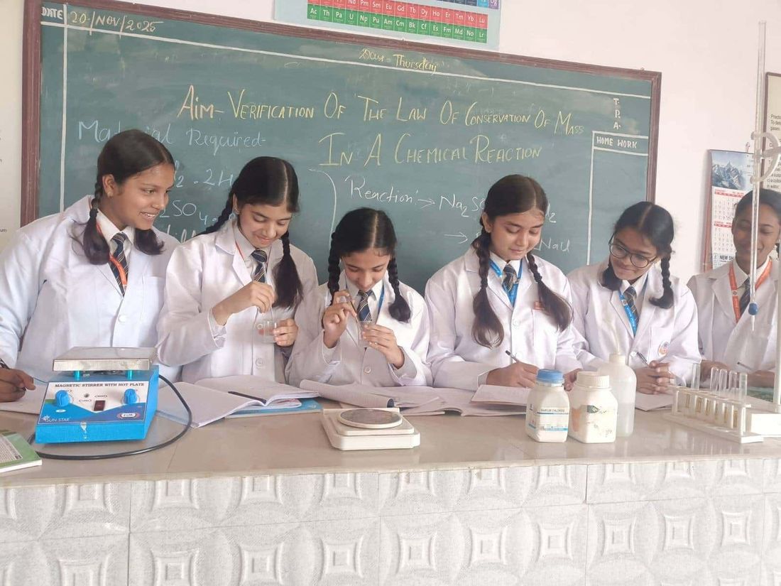 Students of Sunbeam School Ballia working at the bench during a science practical