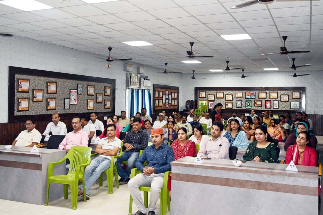 Parents of Sunbeam School Ballia seated in the hall at a Parents’ Forum session, each desk carrying a class placard