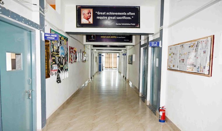 A noticeboard-lined corridor in the academic block at Sunbeam School Ballia.