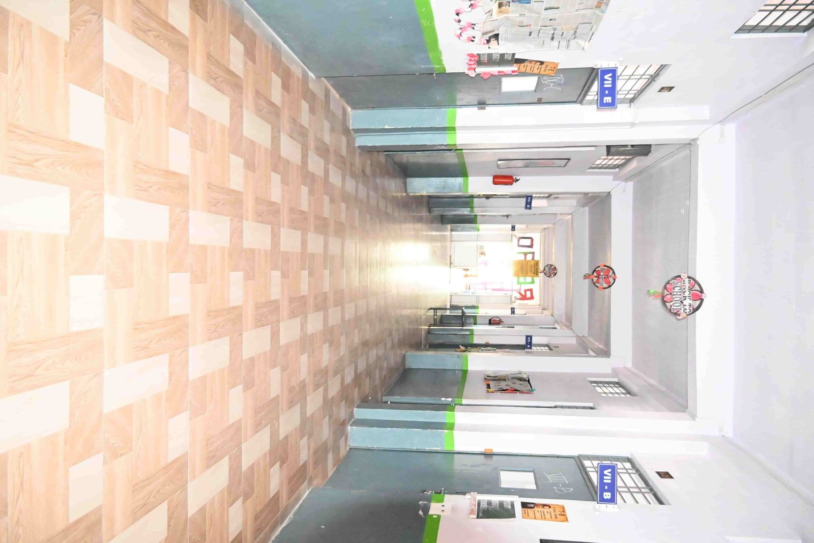 A corridor at Sunbeam School Ballia, its noticeboards ranged along the wall.