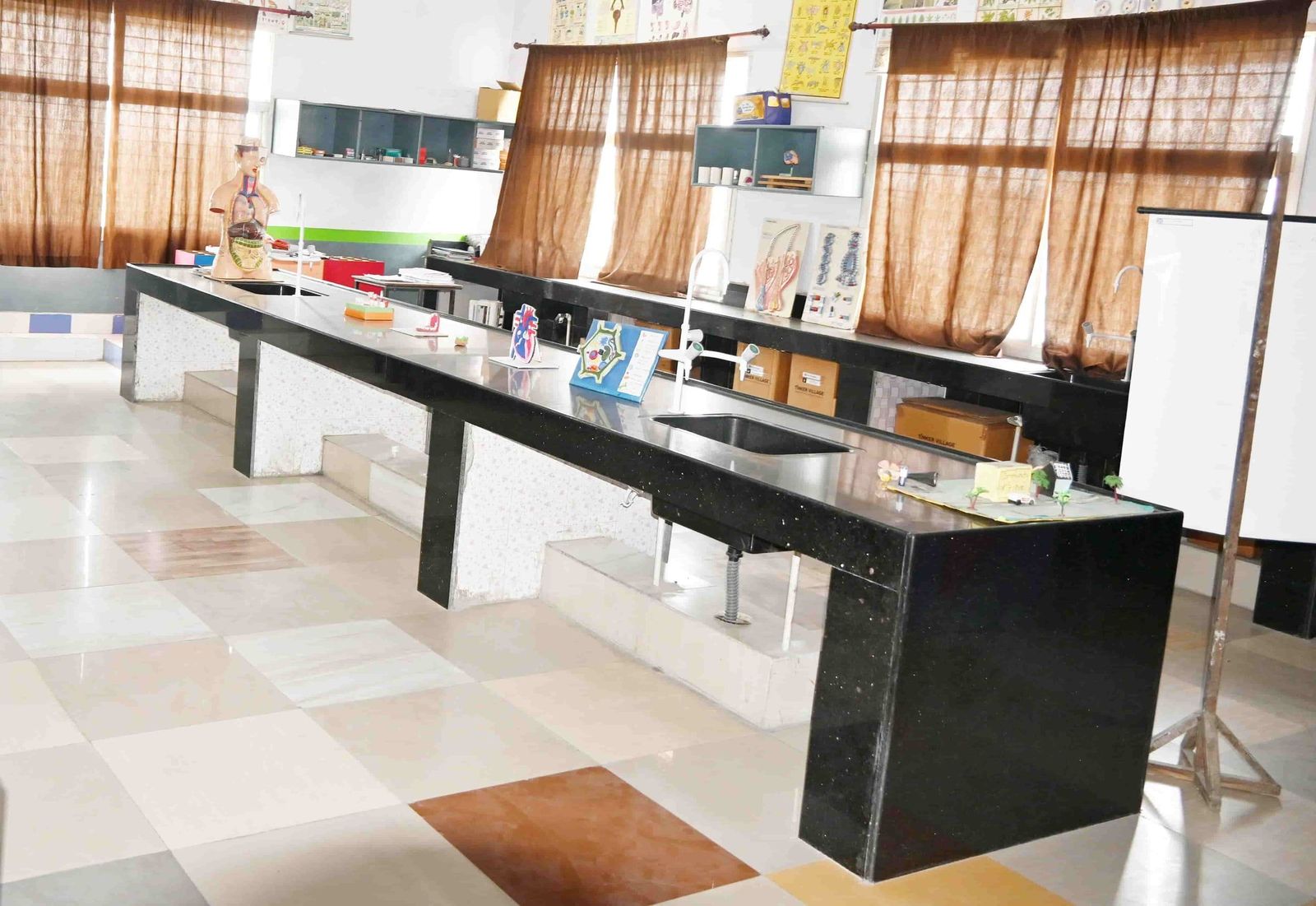 The composite laboratory at Sunbeam School Ballia, its benches and apparatus laid out along the room.