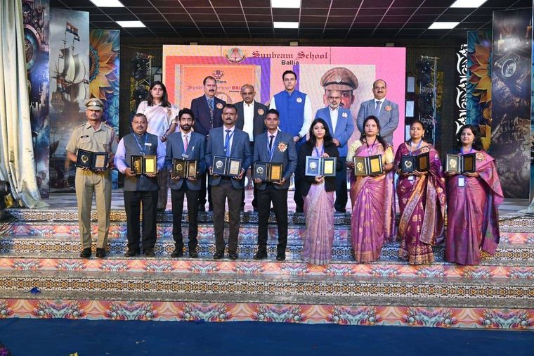 An award ceremony on stage in the hall at Sunbeam School Ballia.