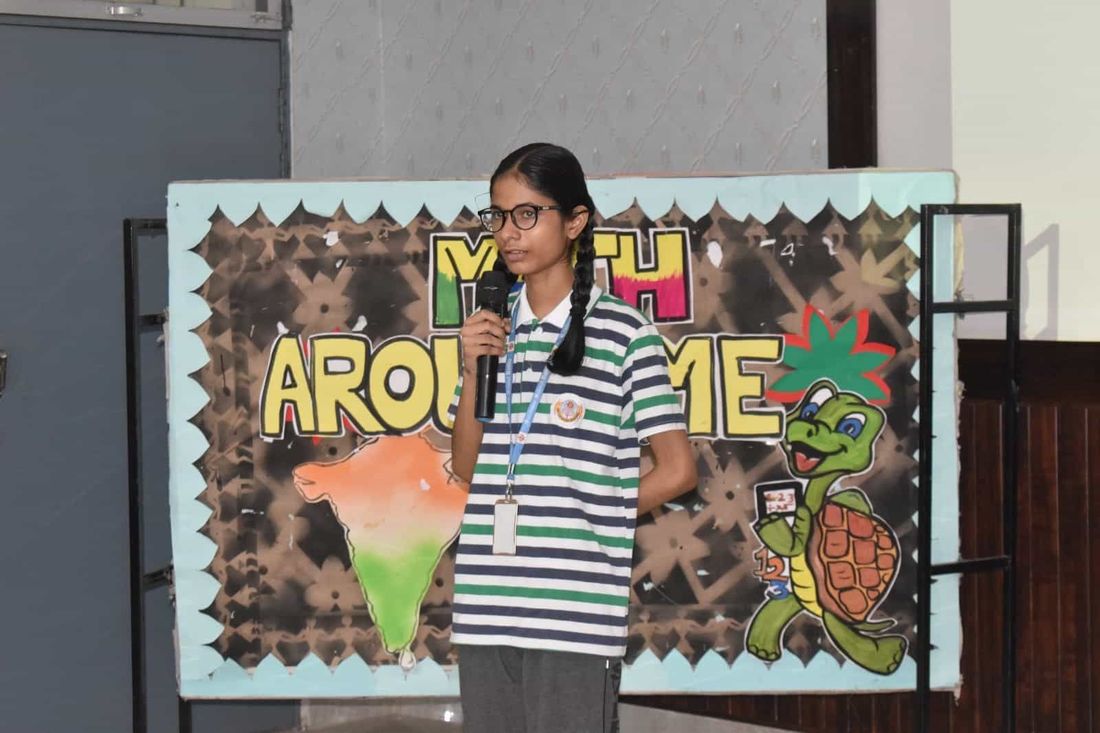 A student of Sunbeam School Ballia presenting at the microphone during the Impetus “Math Around Me” session
