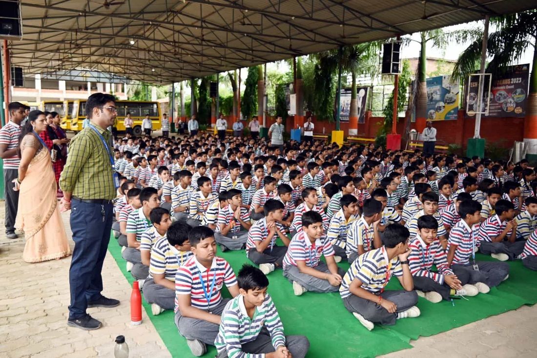 Junior classes of Sunbeam School Ballia seated together under the covered ground at an Impetus gathering