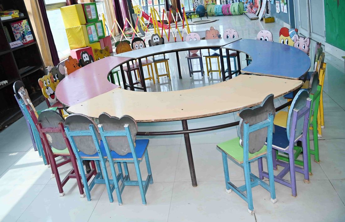The activity learning laboratory at Sunbeam School Ballia — one crescent table with chairs set all the way round it