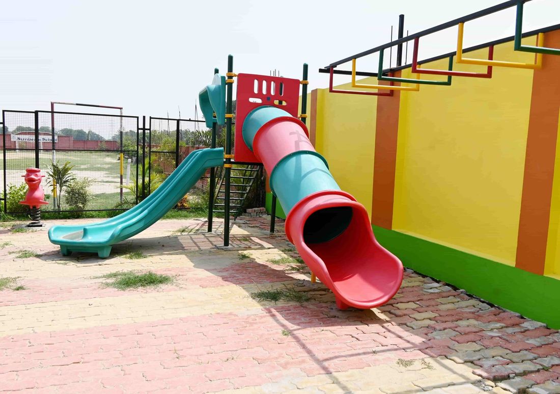 The slide, tunnel and climbing frames in the early-years kids park at Sunbeam School Ballia