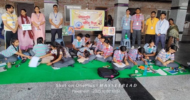 Sunbeam School Ballia students painting live at Ballia railway station — photograph 2 of 4