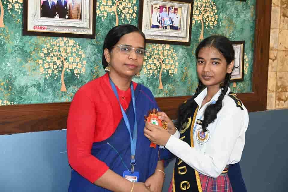A student of Sunbeam School Ballia in a prefect’s sash with a member of staff, from the school’s Ardent Reader Award photographs