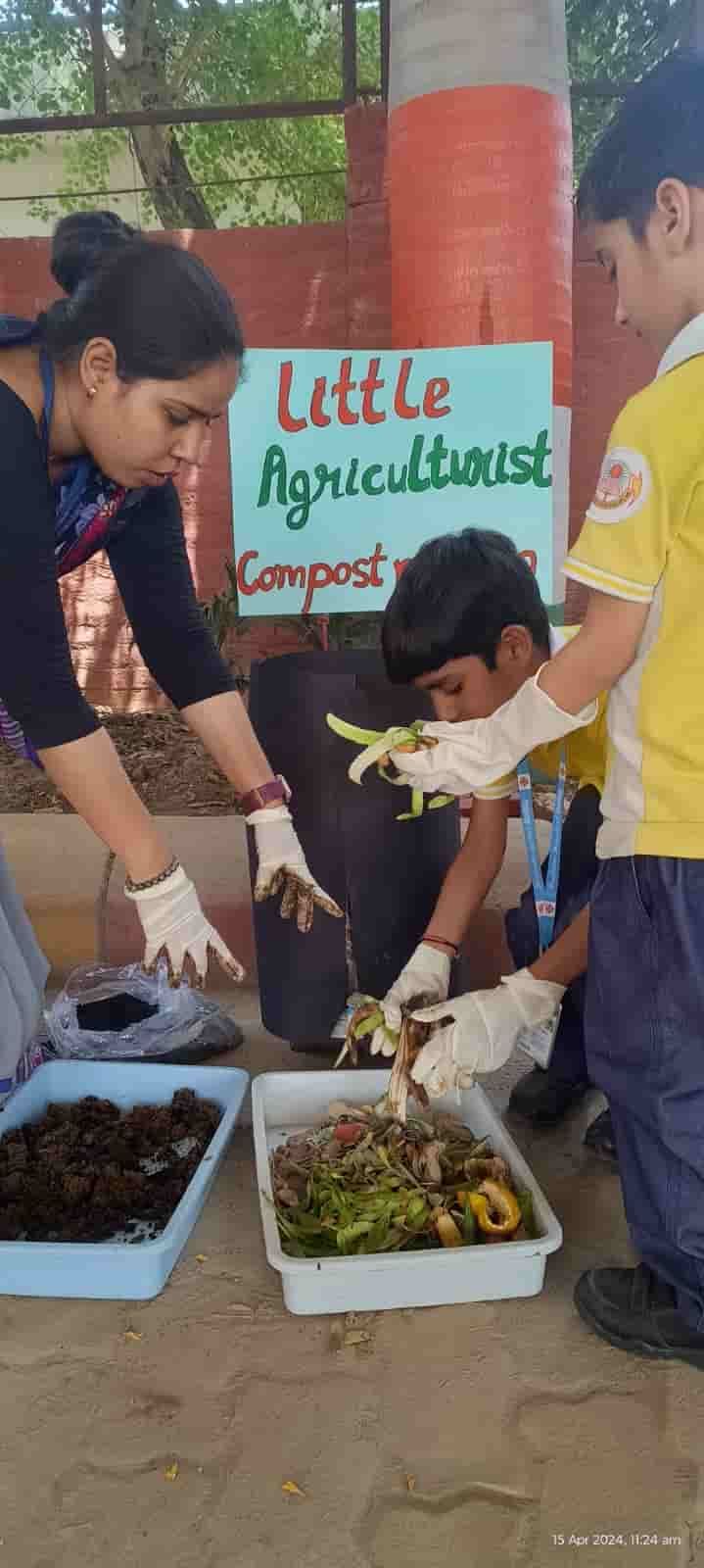 Young students of Sunbeam School Ballia in gloves sorting kitchen peel for compost at the Little Agriculturists activity