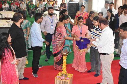 Staff and alumni of Sunbeam School Ballia gathered around the garlanded brass lamp on the red carpet as it is lit to open Pradiptam 2.0.