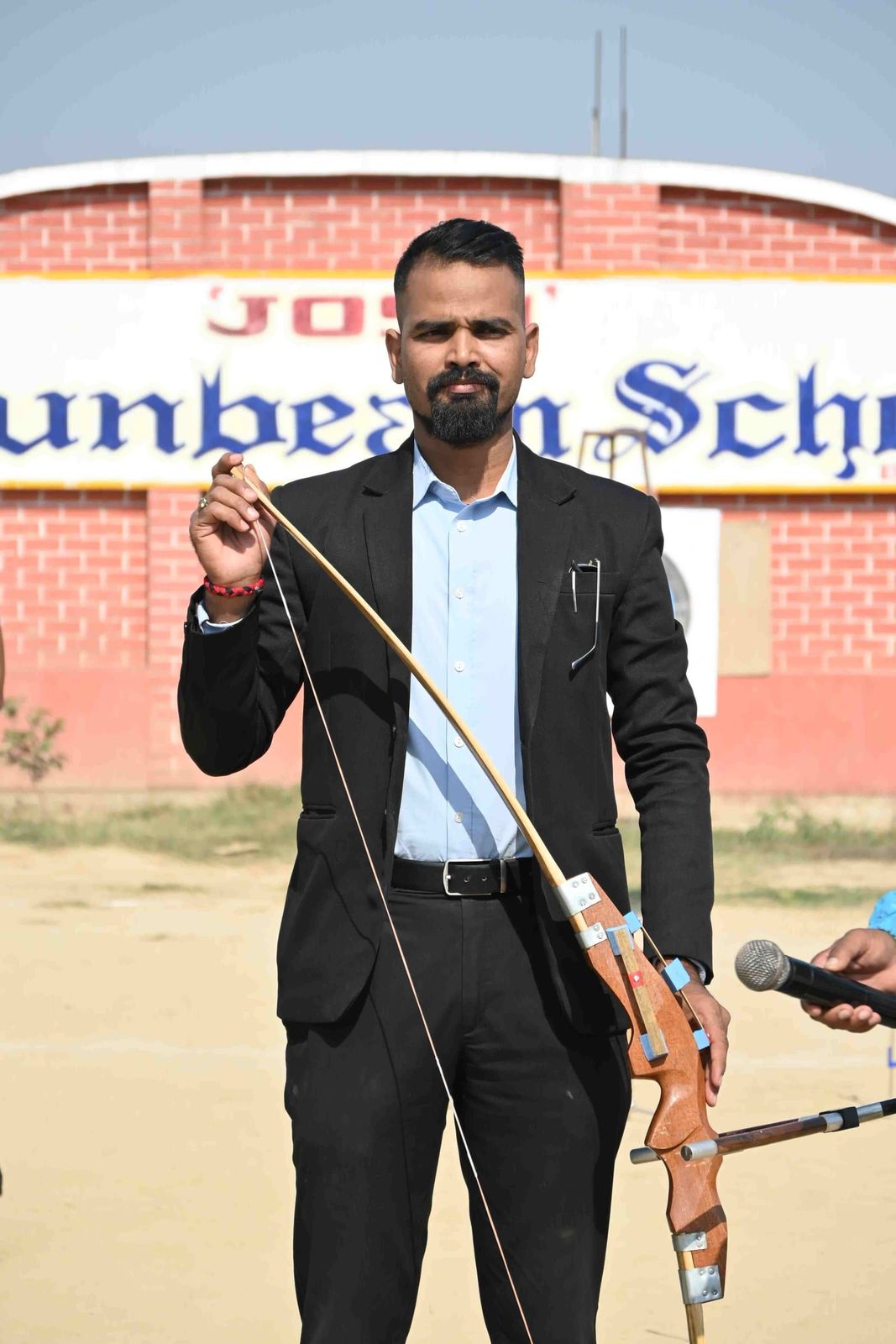Students of Sunbeam School Ballia on the archery line, at full draw
