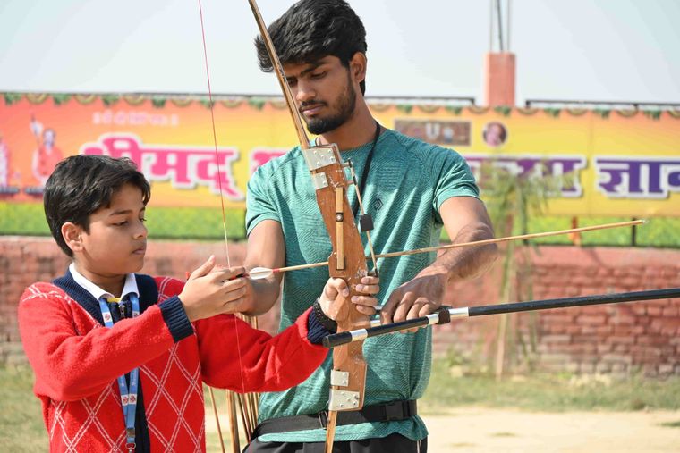Students of Sunbeam School Ballia on the archery line, at full draw