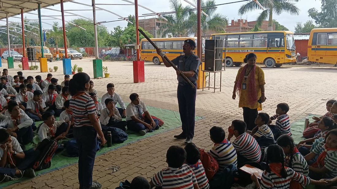 A Scout of Sunbeam School Ballia demonstrating with a stave to the troop drawn up around him.