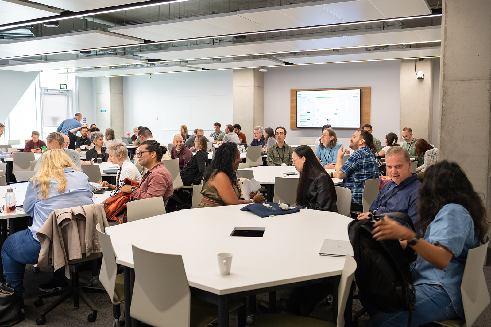 IRSC26 attendees collaborating around tables