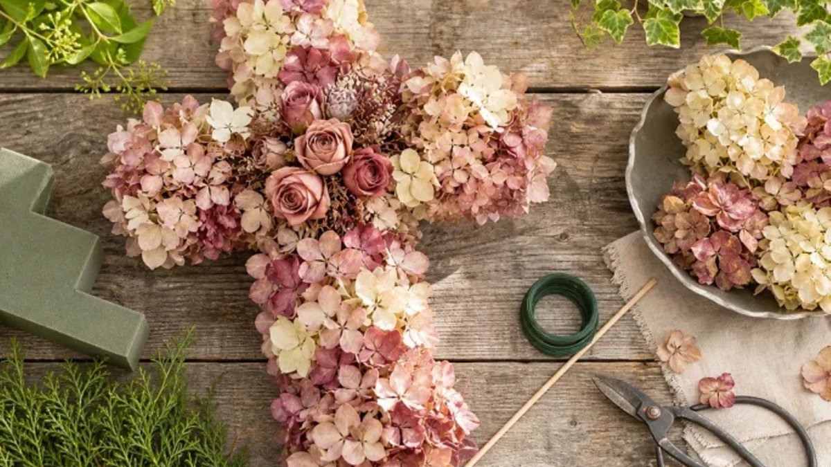 Dried Hydrangea Grave Cross Tribute A cross full of blooms: the grave arrangement that looks especially quiet on All Saints' Day.