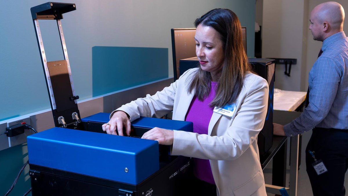 Immunotherapy Rewrites Melanoma Lymph Node Environment Jessica Lancaster, Ph.D., Mayo Clinic immunologist, places a sample into a light-sheet microscope as a colleague works behind