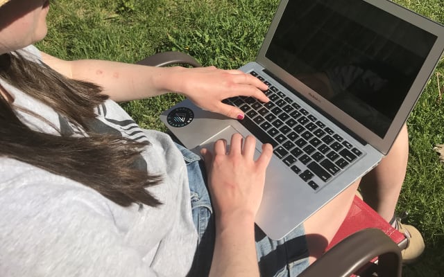 Woman outside learning from home