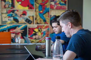 Two students working on programming