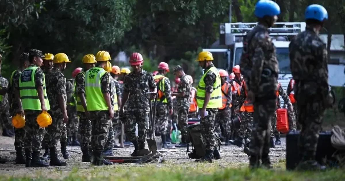 Rescuers claw through mud as Nepal, China flood death toll c