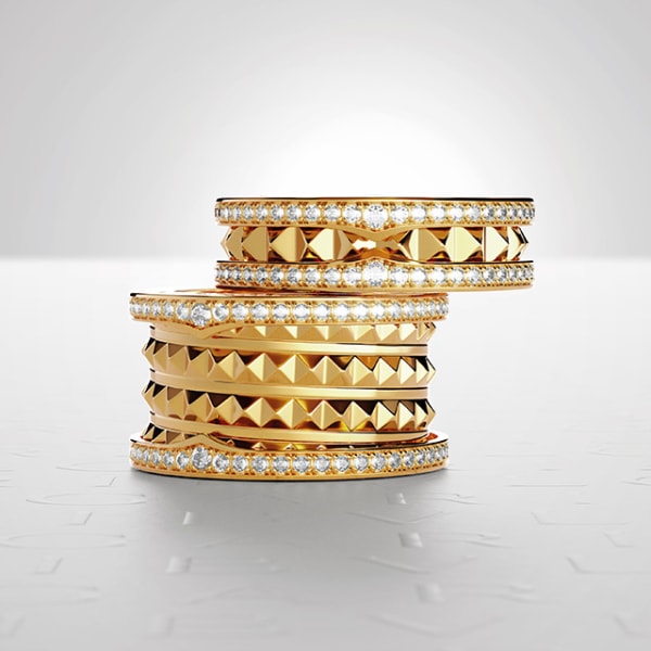 B.zero1 Rock one-band and three-band rings in yellow gold with studded spiral and diamonds.