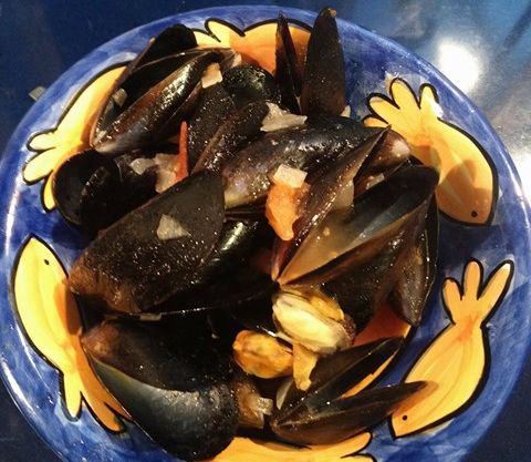 Mussels in a tomato and white wine sauce. | bunch