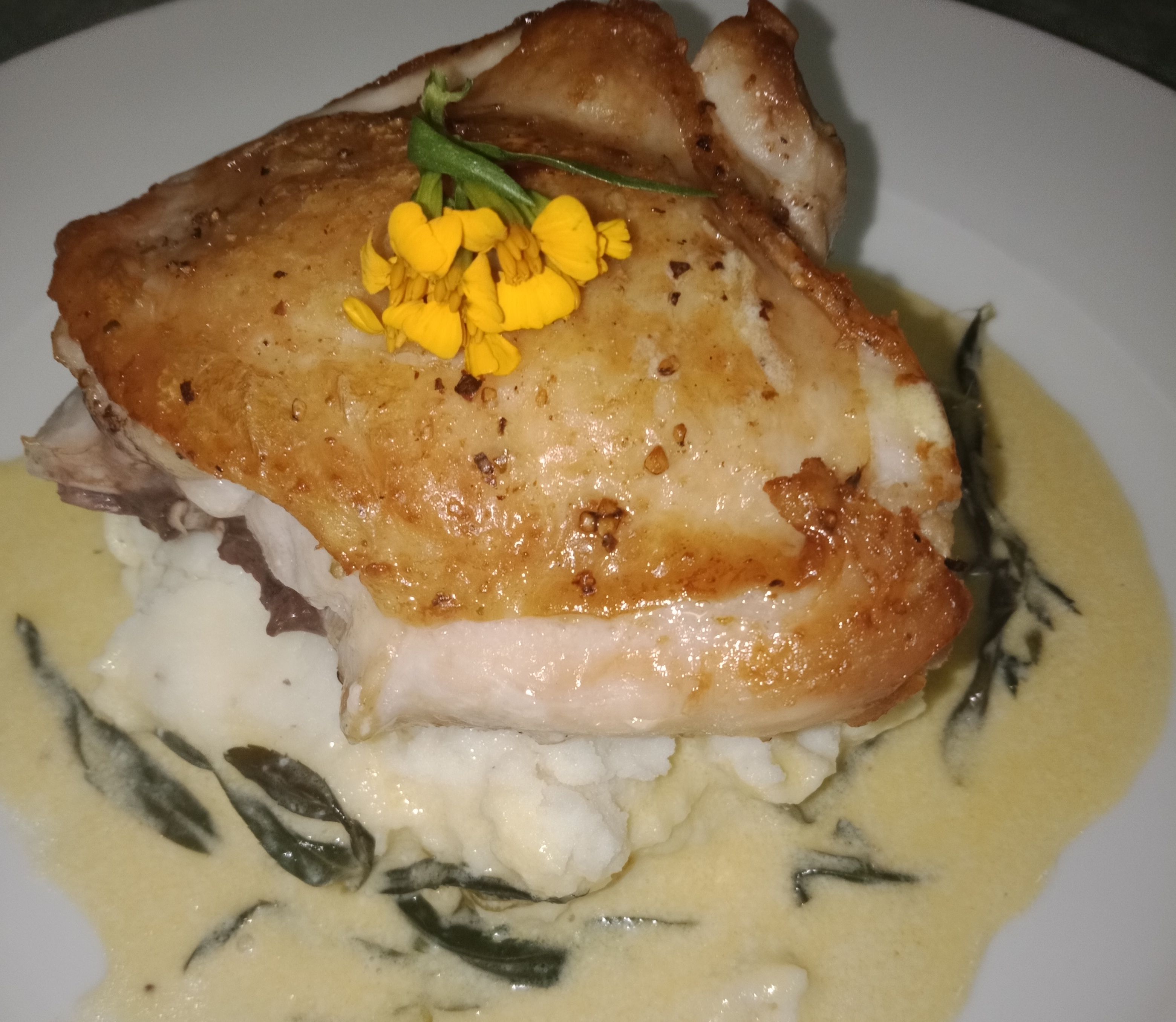 Crispy skin chicken with tarragon butter sauce bunch