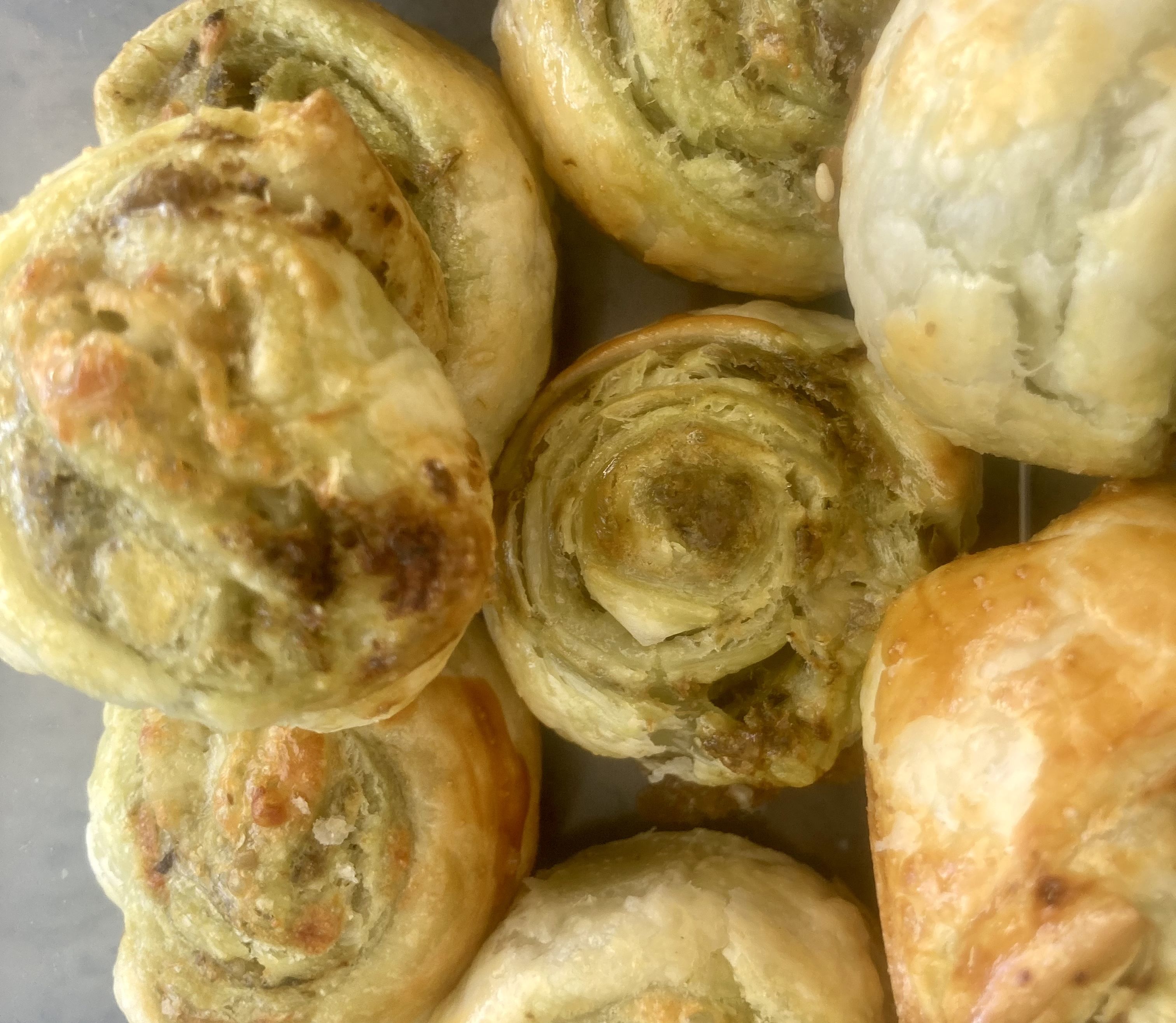 Pesto and cheese puff pastry scrolls bunch