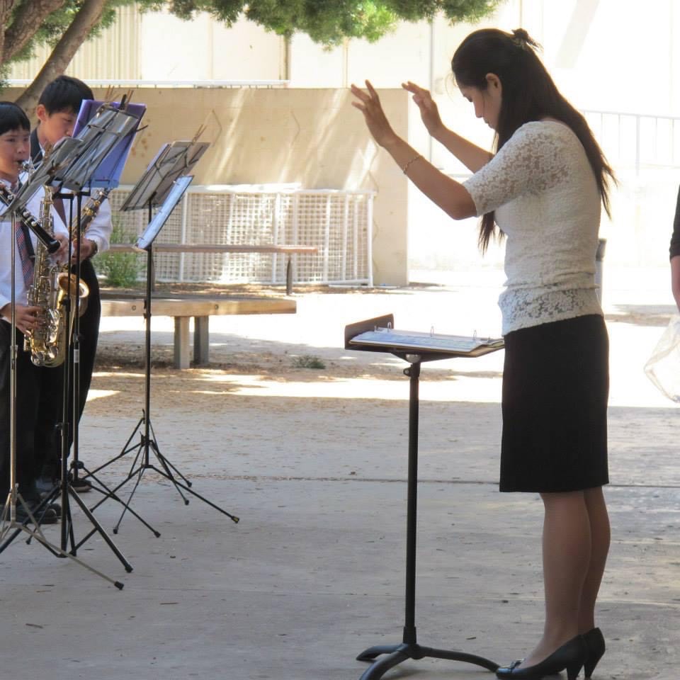 Weili instructing music students
