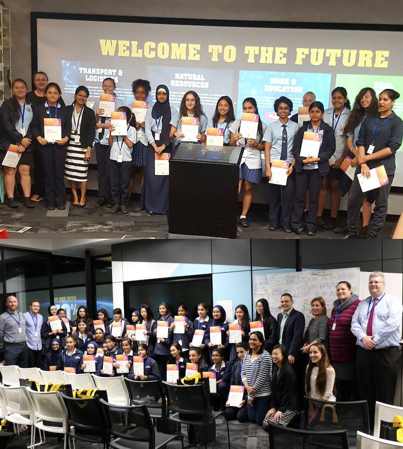 A photo of school girls showing their coding class certificates