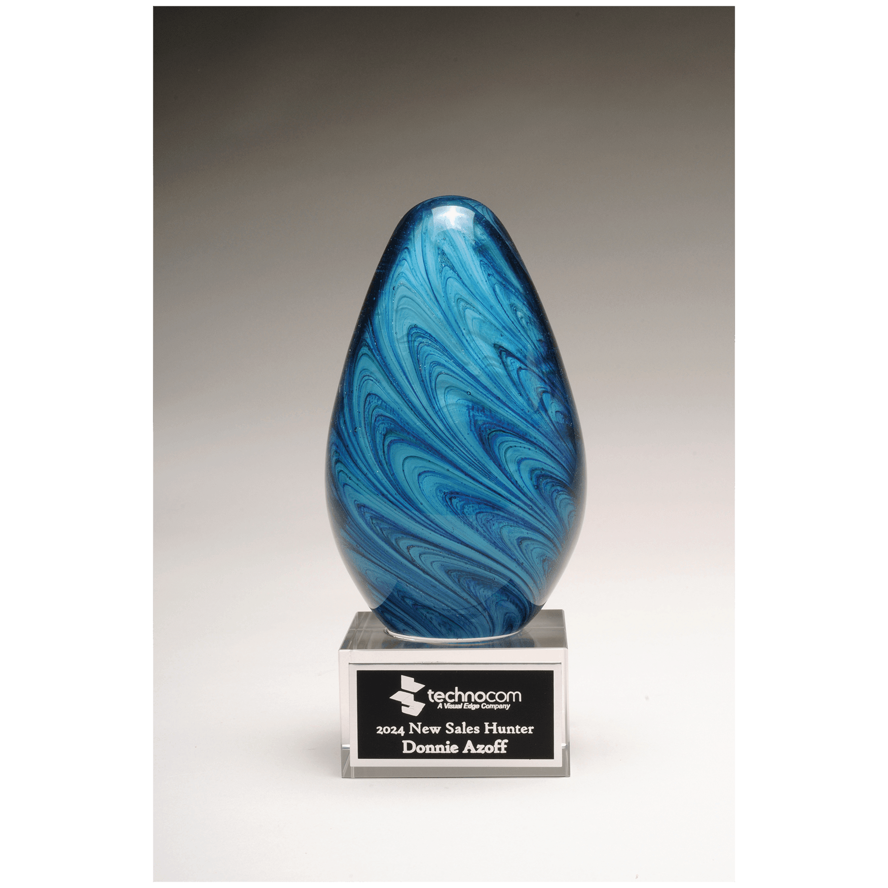 6 1/4" Blue and Green Egg Shaped Art Glass on Clear Glass Base with Black Laserable Aluminum Plate