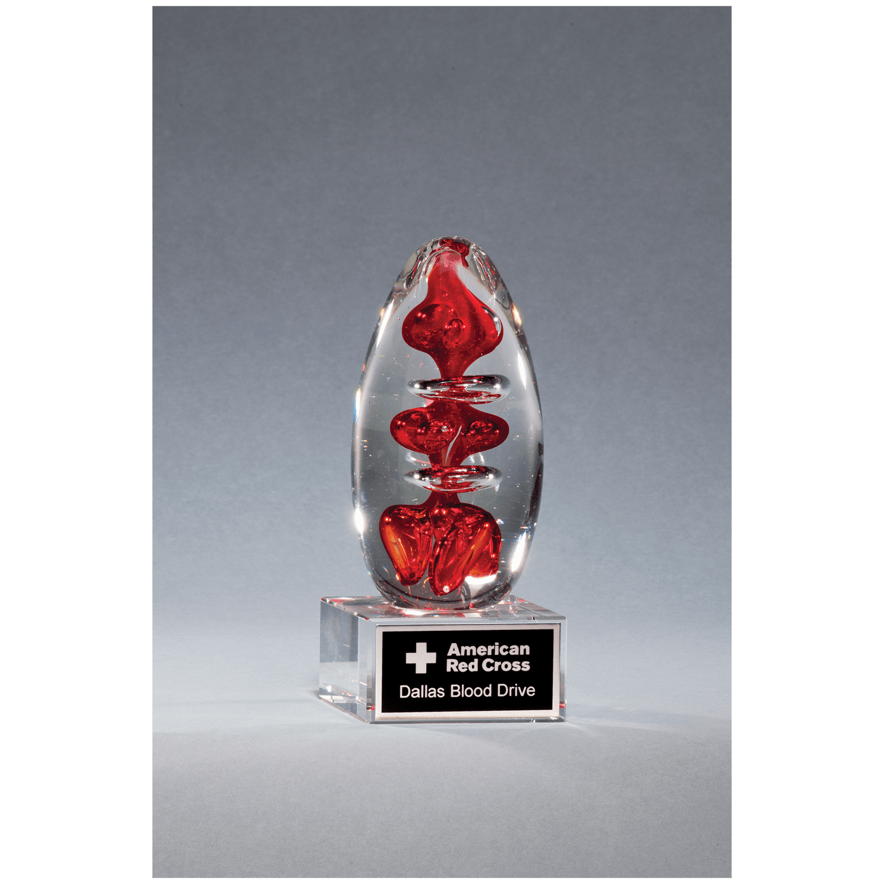 5 1/4" Red Egg Shaped Art Glass on Clear Glass Base with Black Laserable Aluminum Plate