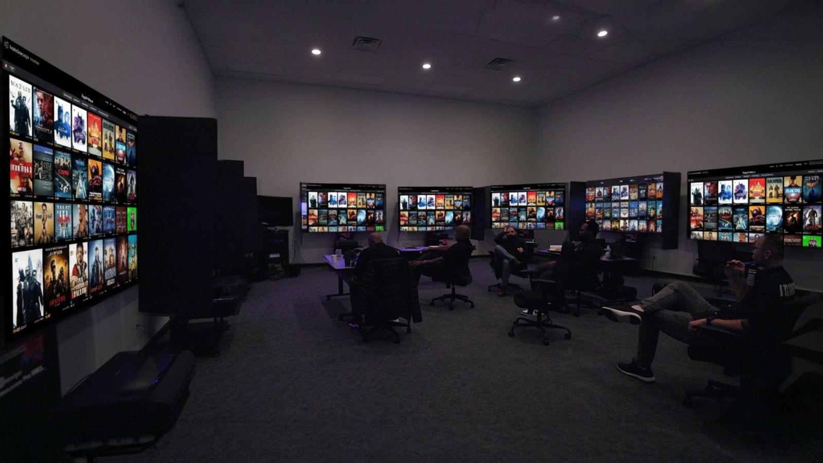 The ProjectorScreen.com demo room in Riverdale, NJ, with a row of projection screens set up side by side