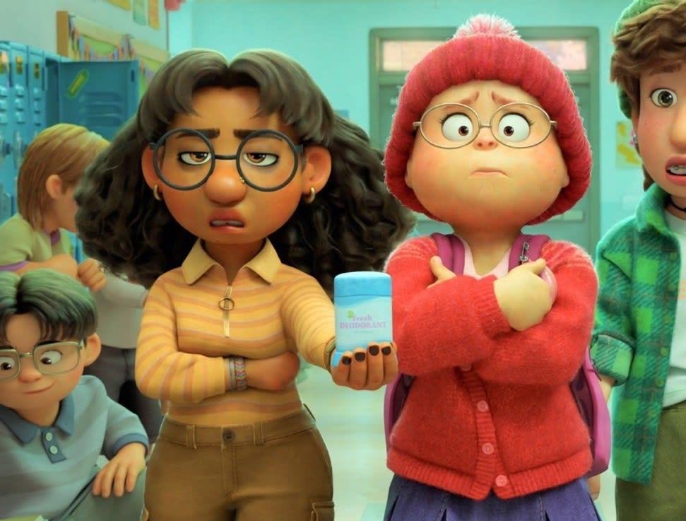 An young female Indian animated character who has large round glasses and curly hair