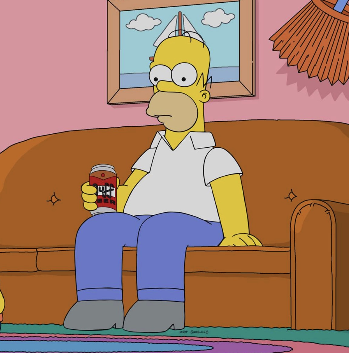 Homer on the brown couch