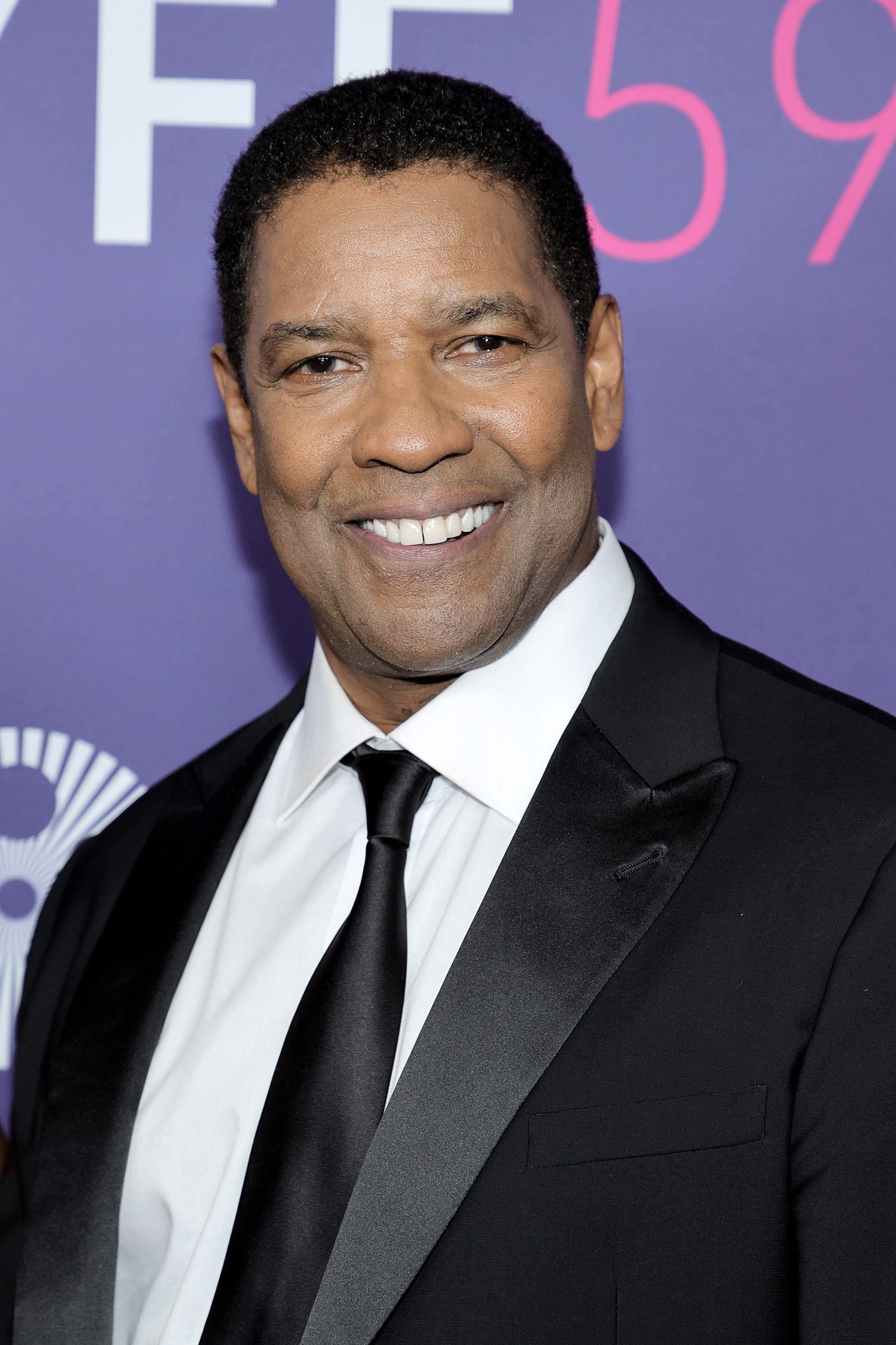 Denzel at an event in a suit and tie