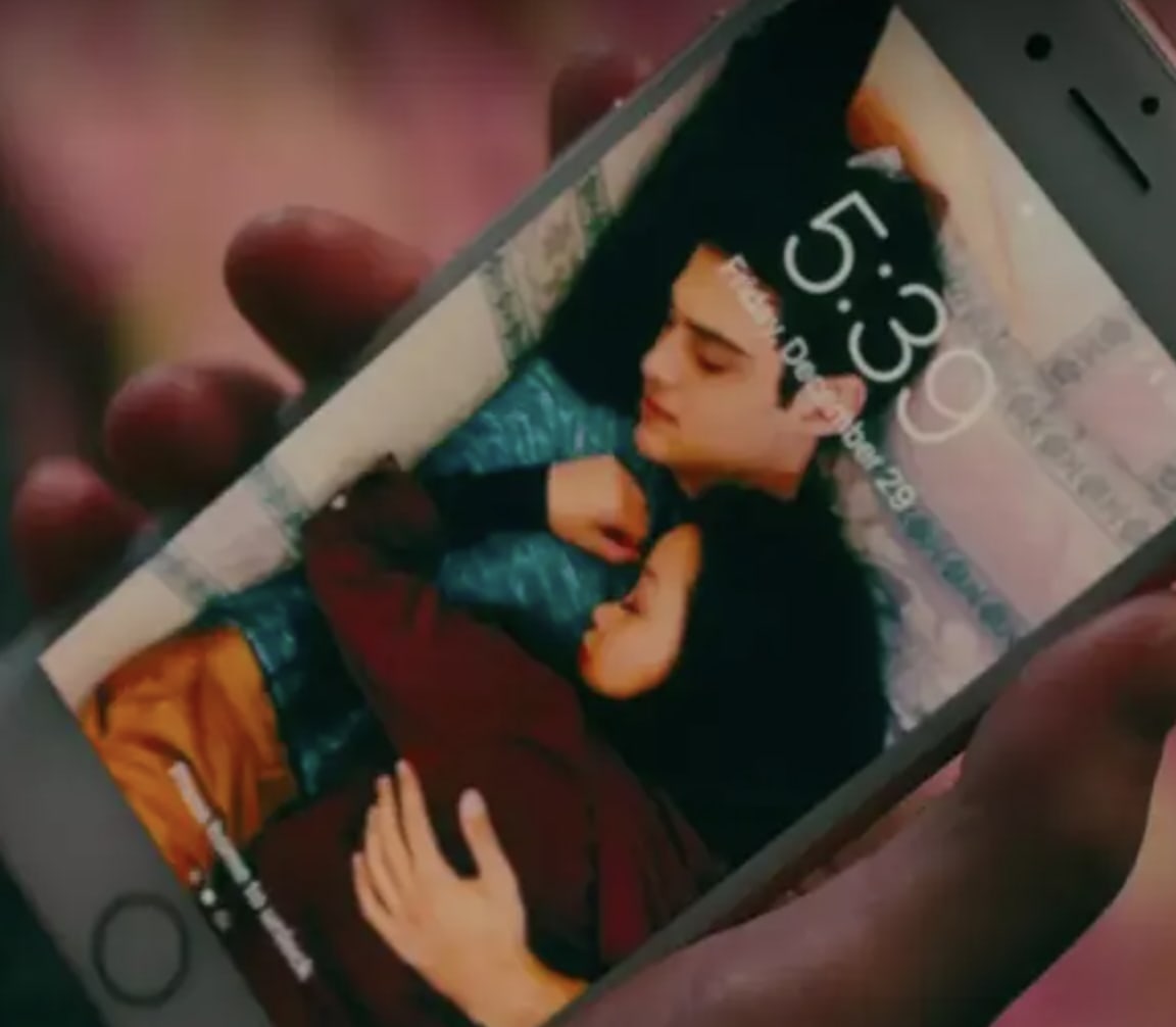 Lara Jean's lock screen of her and Peter cuddling